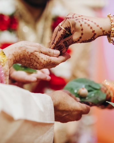 Ritual with coconut leaves during traditional Hindu wedding ceremony